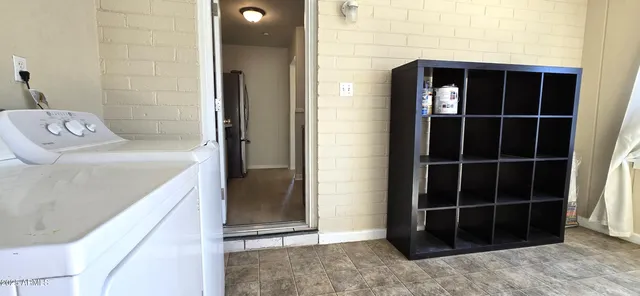 a view of a walk in closet and empty room