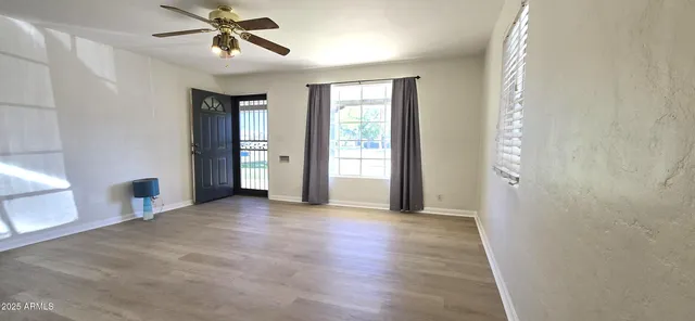 a view of an empty room with a window