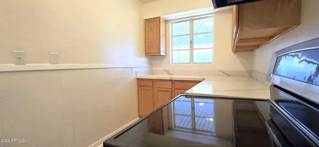 a view of a bathroom with bathtub and window