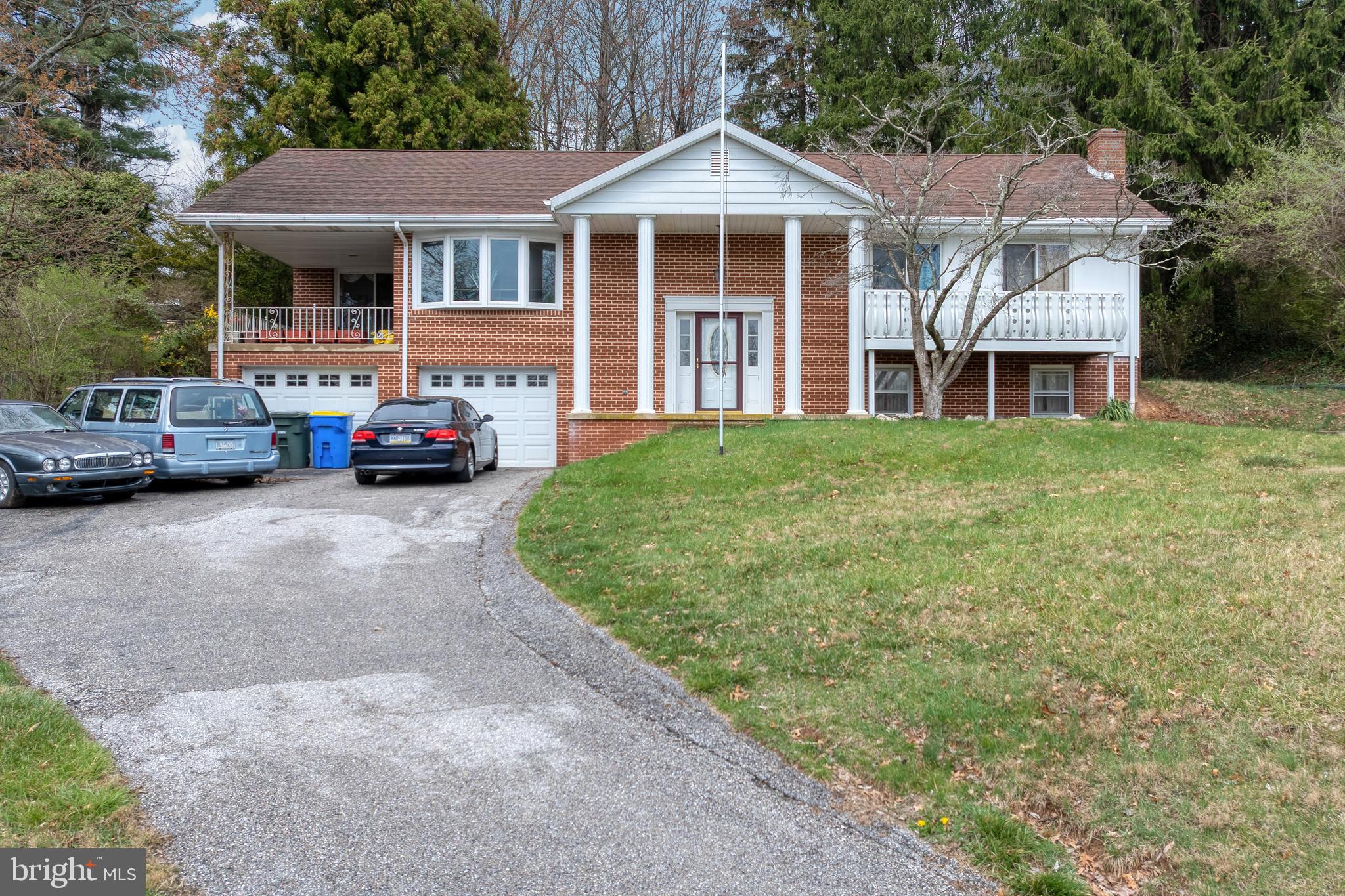 175 Scott Road York, PA 17403 - Photo 1 of 34 a front view of a house with cars parked