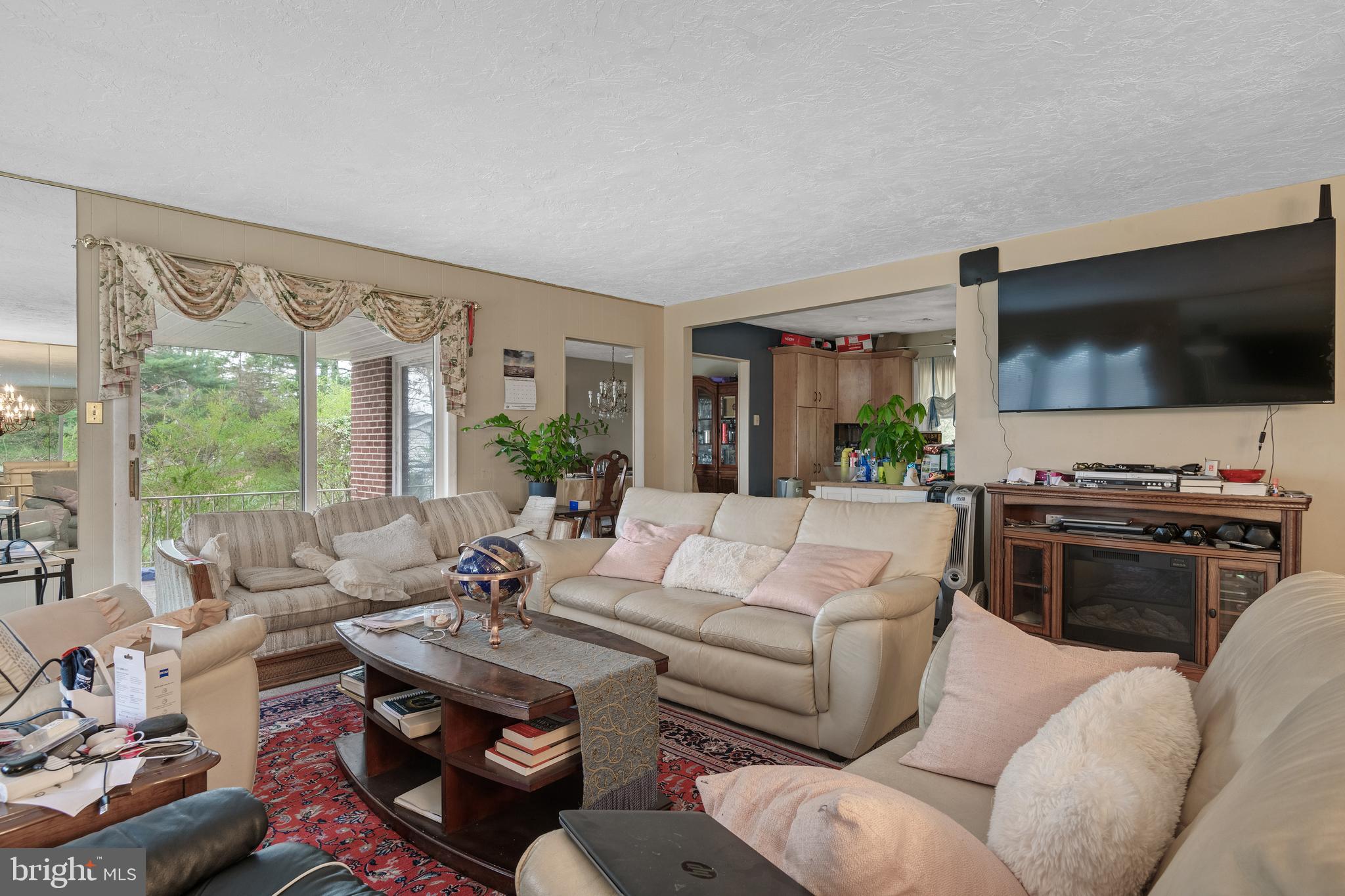175 Scott Road York, PA 17403 - Photo 7 of 34 a living room with furniture a flat screen tv and a large window