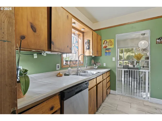 a kitchen with a sink and a window