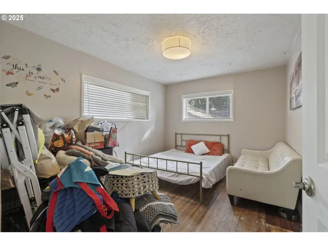 a bedroom with furniture and a window