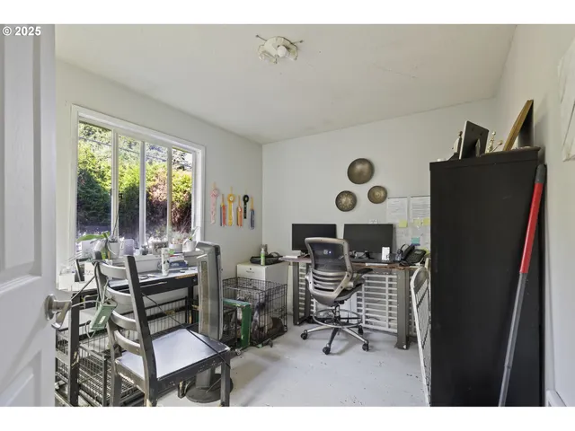 a work room with furniture and wooden floor
