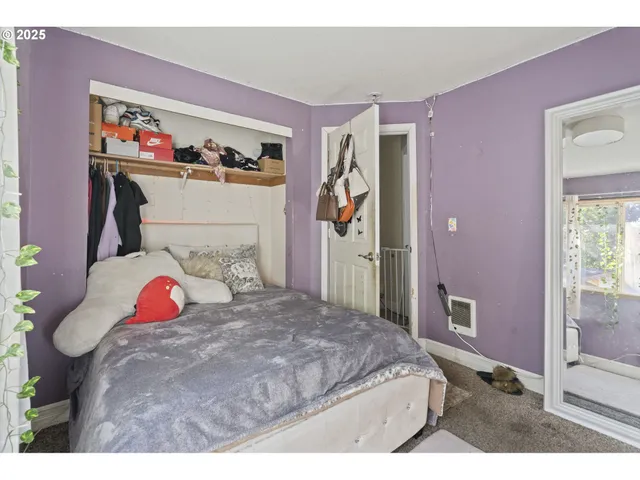 a bedroom with a bed and closet