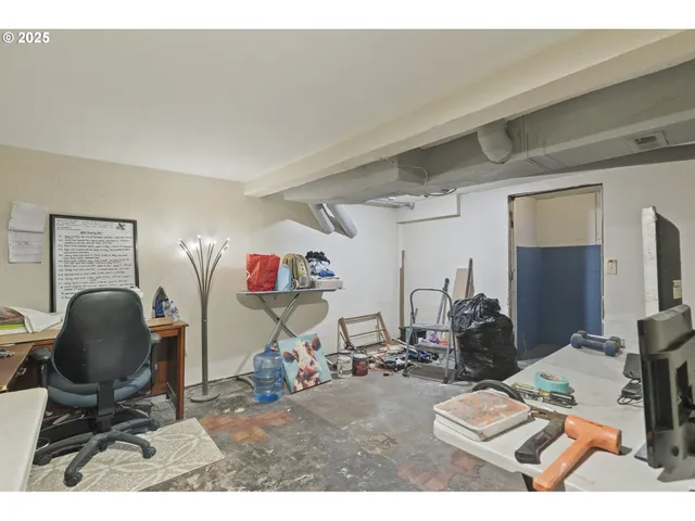 a living room with furniture and a mirror