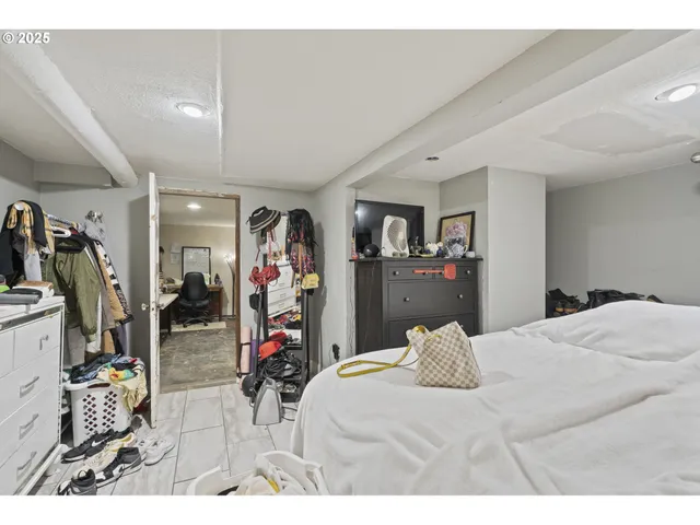 a bed room with a bed and a mirror