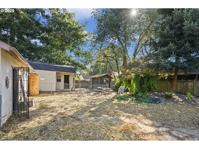 a backyard of a house with lots of green space