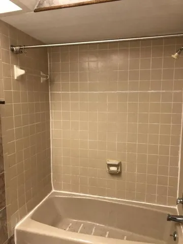 a bathroom with a bath tub