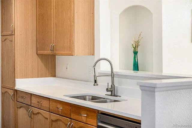 a kitchen with a sink and a window