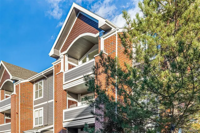 a front view of a house with a street
