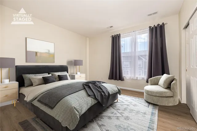 a bedroom with bed and a couch