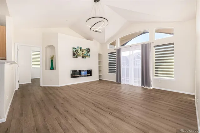 a view of a livingroom with wooden floor