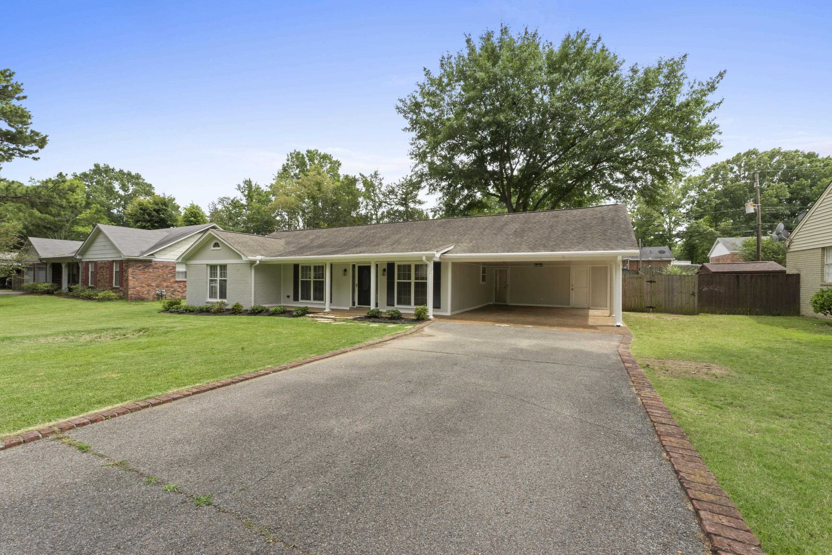 499 Duscoe Street Collierville, TN 38017 - Photo 29 of 38 a front view of house with yard and green space