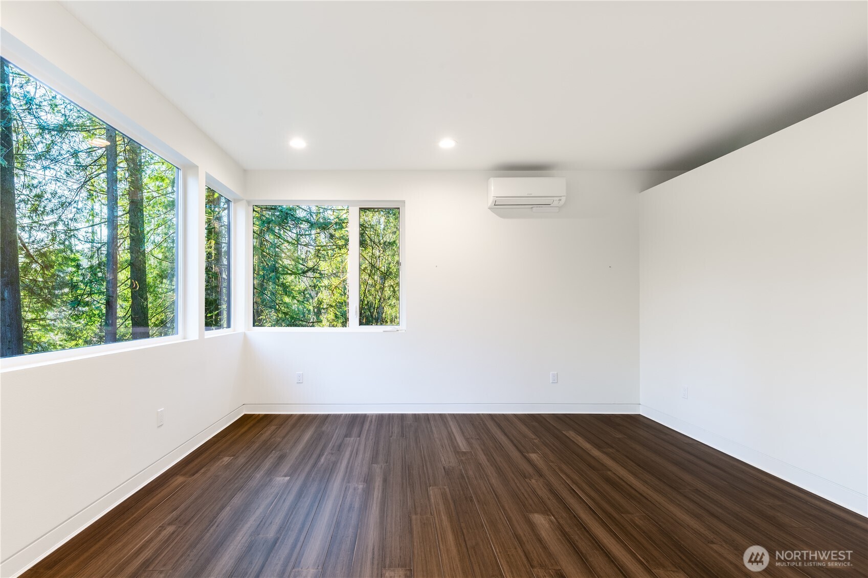 31535 Northeast 114th Street Carnation, WA 98014 - Photo 14 of 33 a view of an empty room with wooden floor and a window