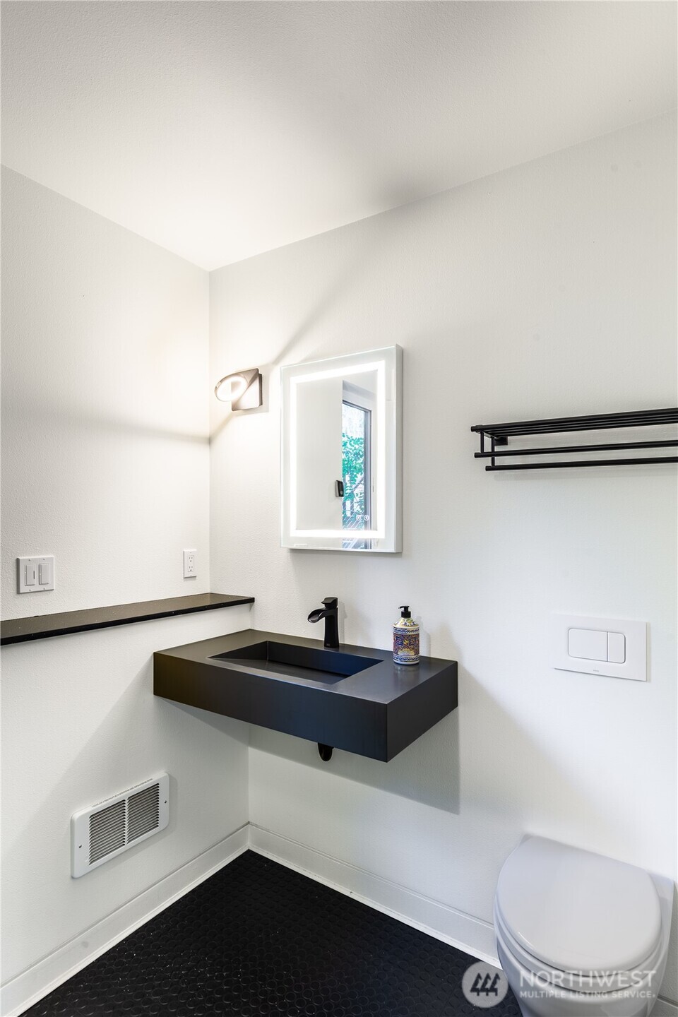 31535 Northeast 114th Street Carnation, WA 98014 - Photo 22 of 33 a bathroom with a sink a toilet and mirror