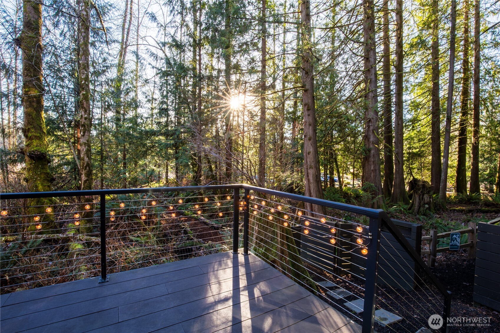 31535 Northeast 114th Street Carnation, WA 98014 - Photo 25 of 33 a view of balcony with wooden floor and trees