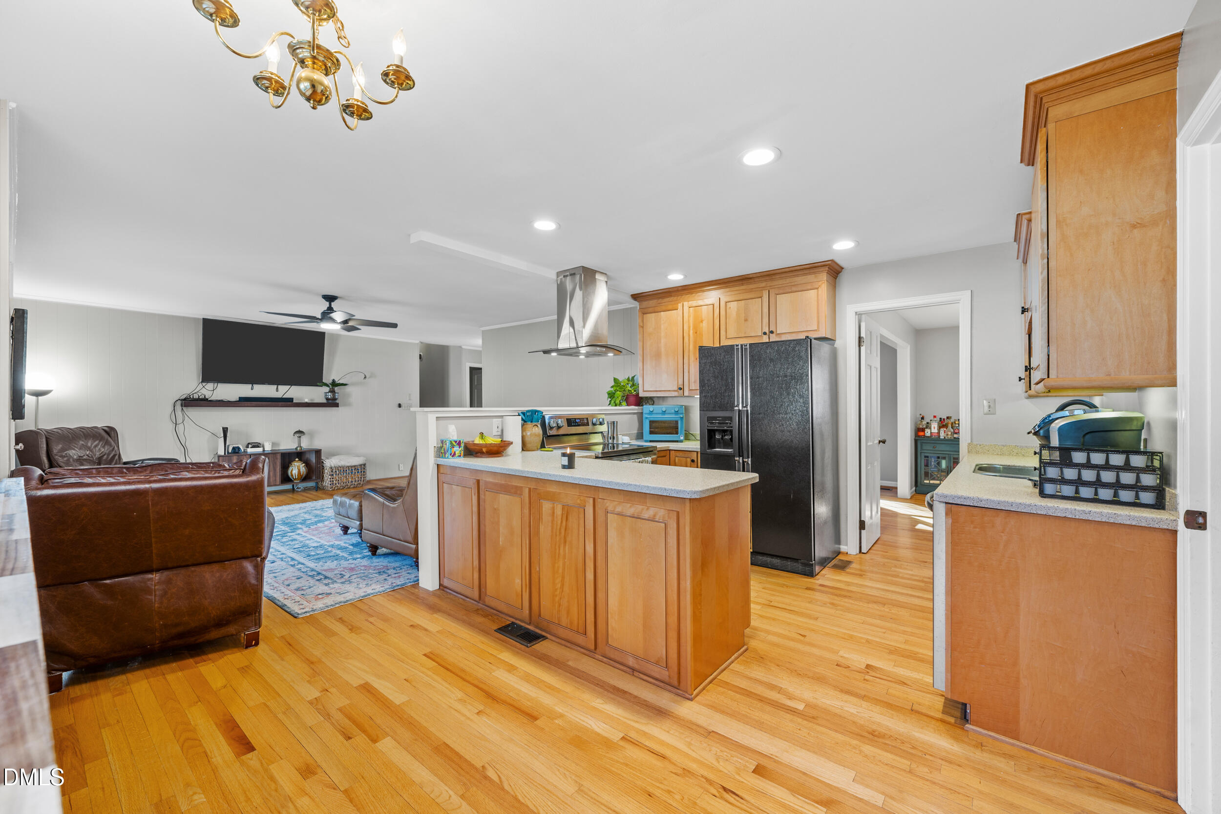 3726 Swift Drive Raleigh, NC 27606 - Photo 14 of 40 a kitchen with stainless steel appliances granite countertop a refrigerator a stove top oven a sink dishwasher and wooden cabinets