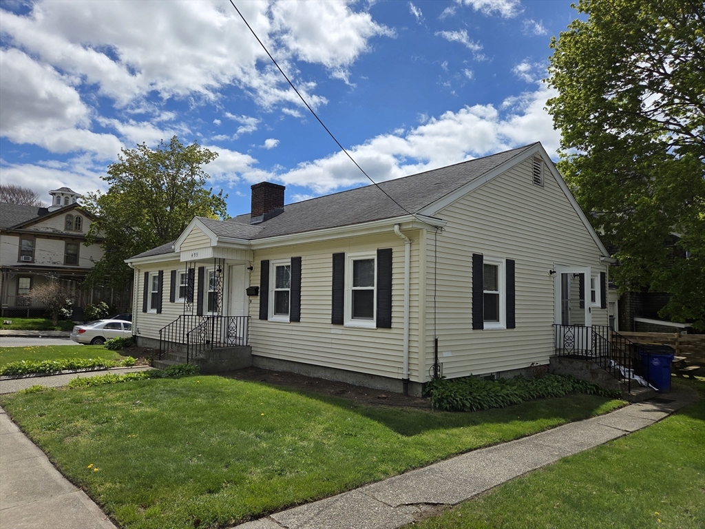 499 Maple Street Fall River, MA 02720 - Photo 1 of 21 a front view of a house with a garden