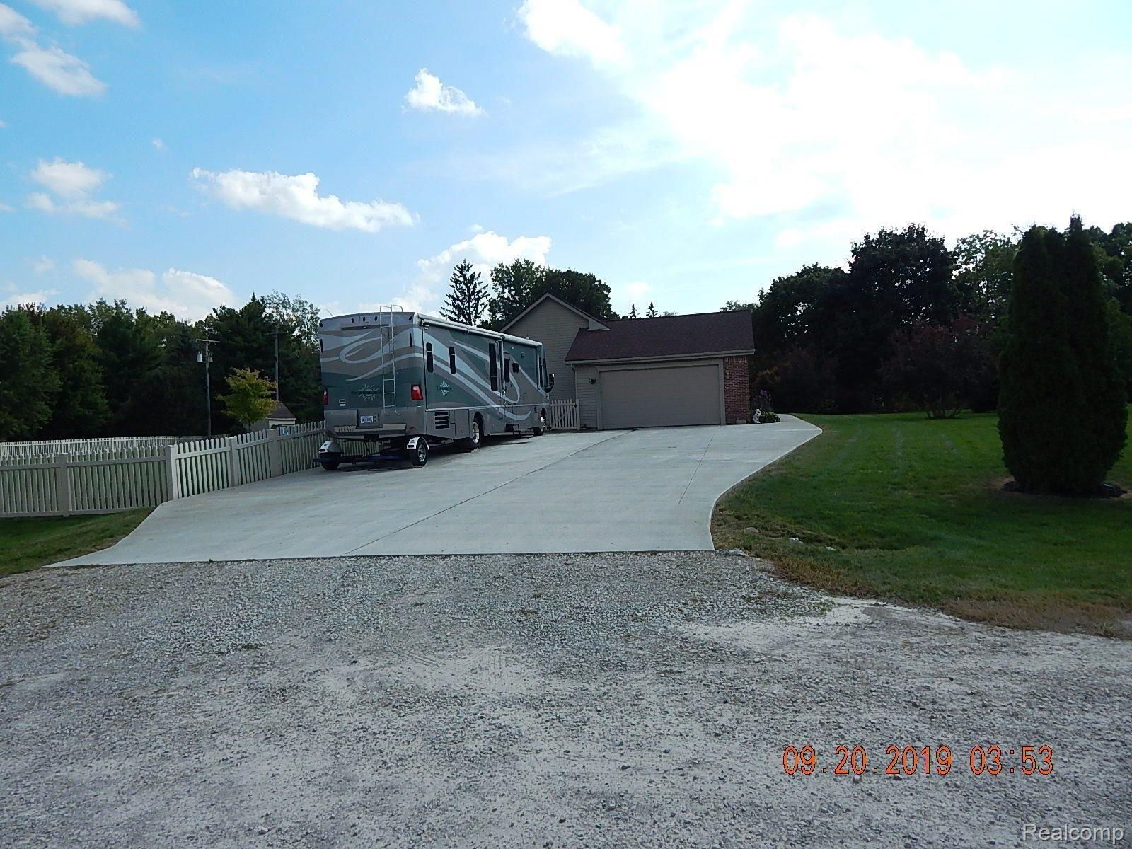 7905 Munger Road Ypsilanti, MI 48197 - Photo 65 of 73 garage and driveway.JPG