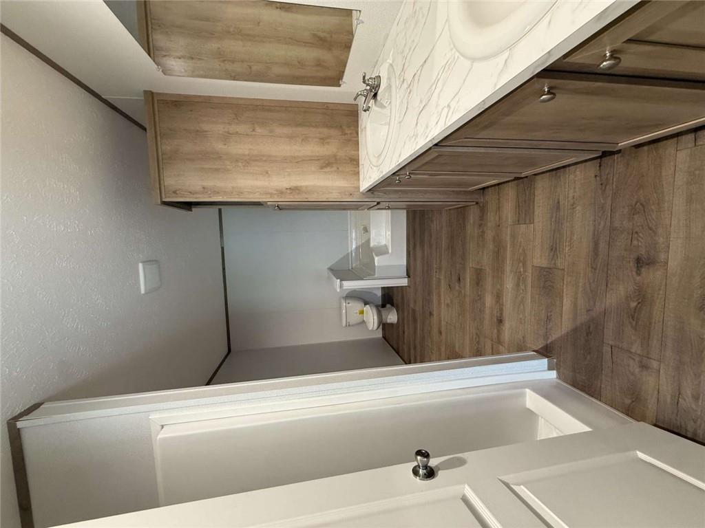 1052 Jones Ferry Road Elberton, GA 30635 - Photo 8 of 16 a bathroom with a sink and mirror