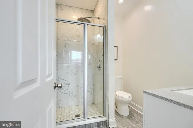 a sink with white cabinets