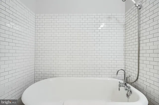 a view of an entryway with wooden floor and stairs