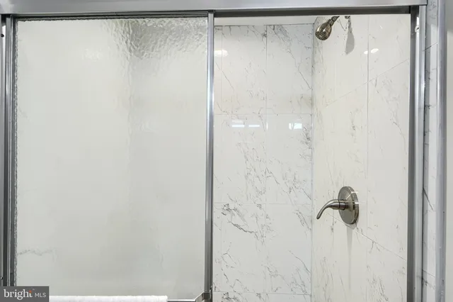 a bedroom with a bed and a potted plant