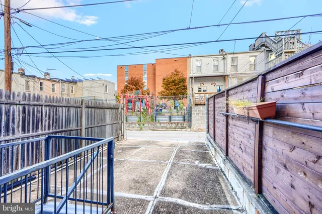 a view of a brick house with many windows
