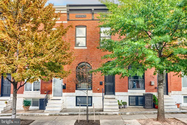 a view of swimming pool with outdoor seating