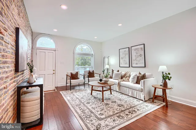 a living room with furniture and a rug