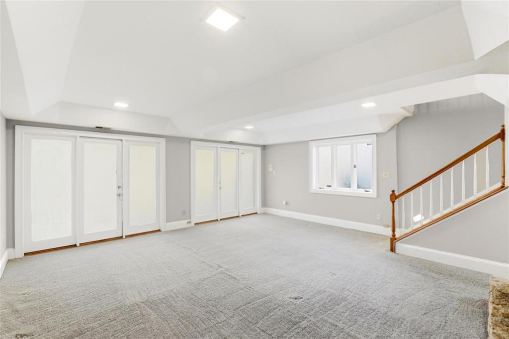 3959 Randall Mill Road Northwest Atlanta, GA 30327 - Photo 20 of 31 a view of an empty room with stairs