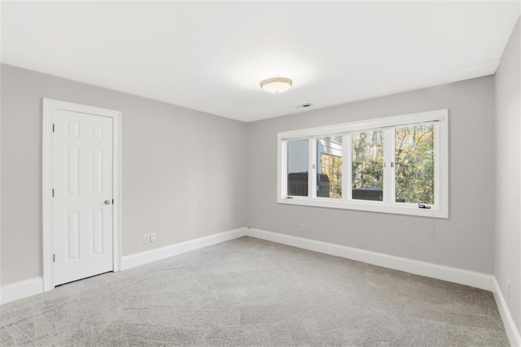 3959 Randall Mill Road Northwest Atlanta, GA 30327 - Photo 22 of 31 an empty room with a window