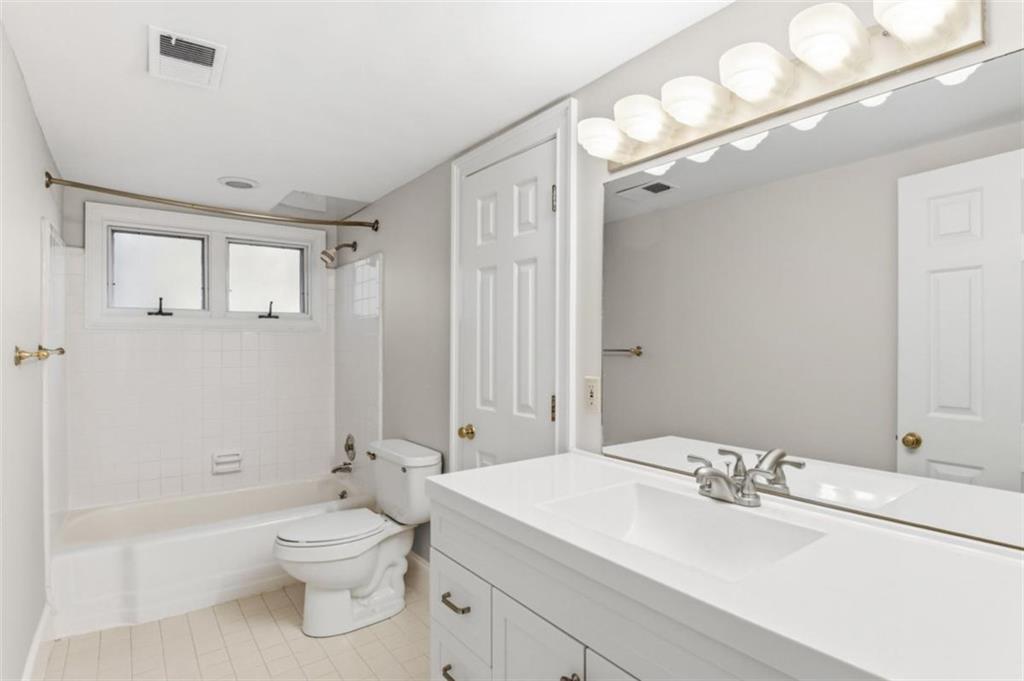 3959 Randall Mill Road Northwest Atlanta, GA 30327 - Photo 26 of 31 a bathroom with a sink a toilet and shower