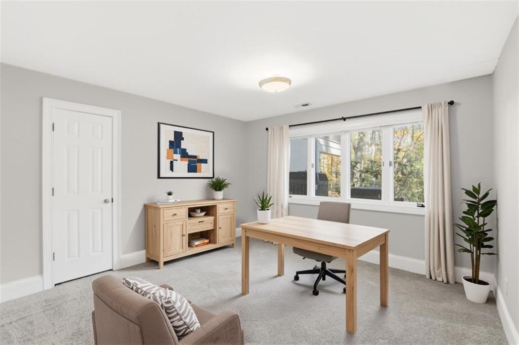 3959 Randall Mill Road Northwest Atlanta, GA 30327 - Photo 5 of 31 a living room with furniture and a window