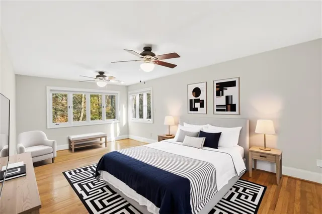 a bedroom with a large bed and a couch