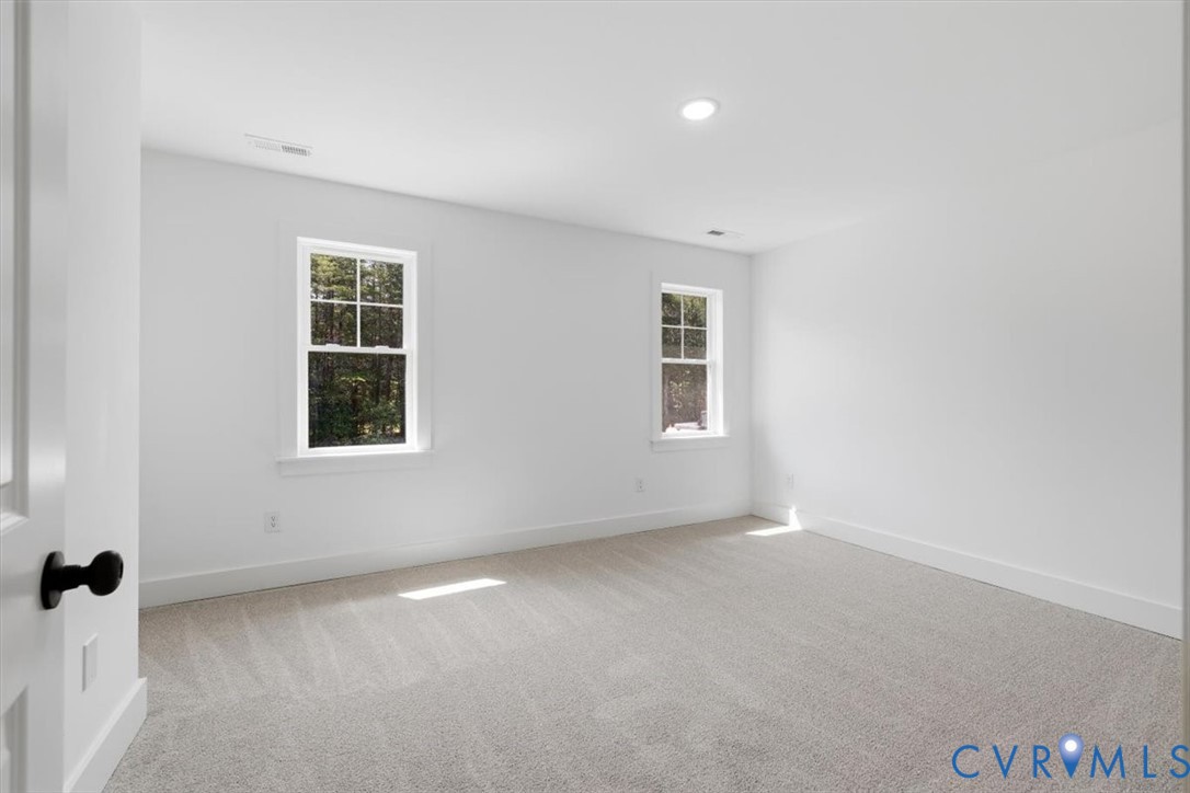 654 Frenchs Store Road Cumberland, VA 23040 - Photo 13 of 24 Spacious room featuring light gray carpeting, cris
