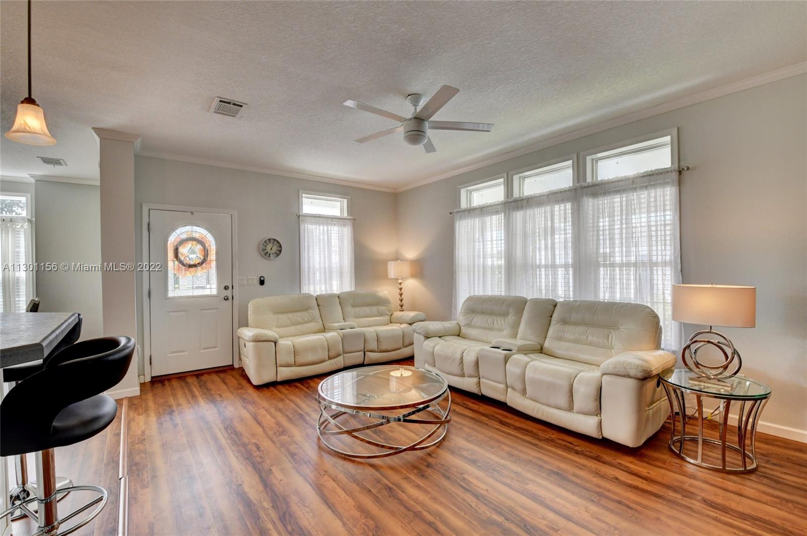 8293 East Club Road Boca Raton, FL 33433 - Photo 5 of 41 a living room with furniture and a large window