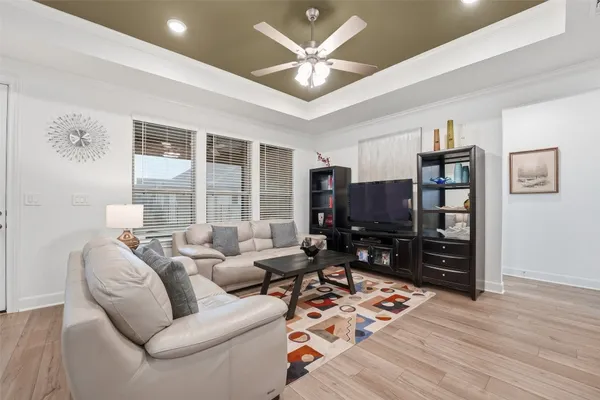 a bed sitting in a bedroom next to a window with a dresser