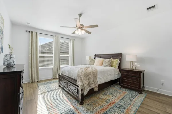 a spacious bathroom with a granite countertop sink mirror and
