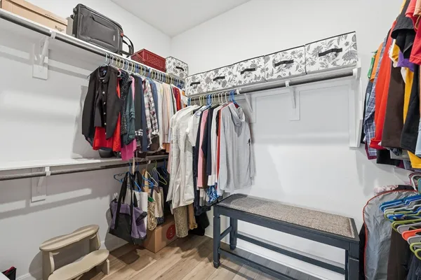a view of a patio with a table chairs and a yard