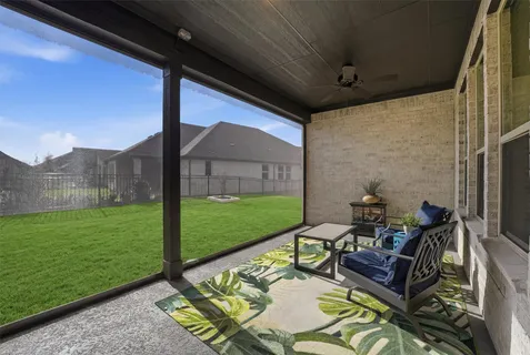 a balcony with furniture and a potted plant