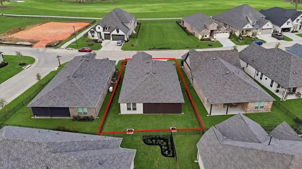 an aerial view of a house with a garden