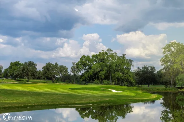 a view of a golf course with a lake