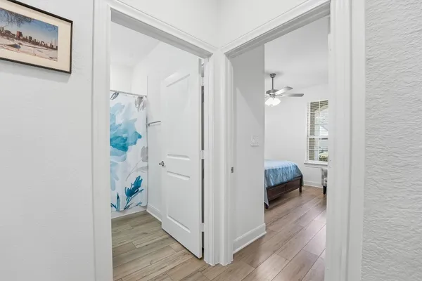 a view of a room that has a table and a chair in it