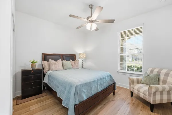 a bedroom with a bed and a couch