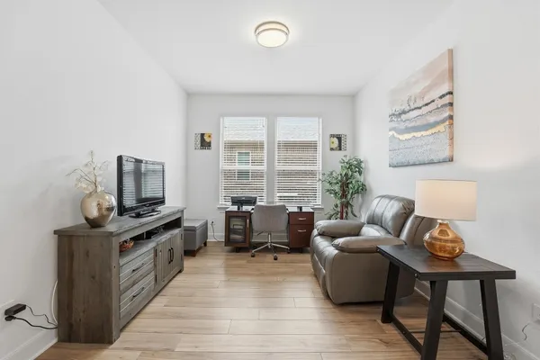 a living room with furniture and a window