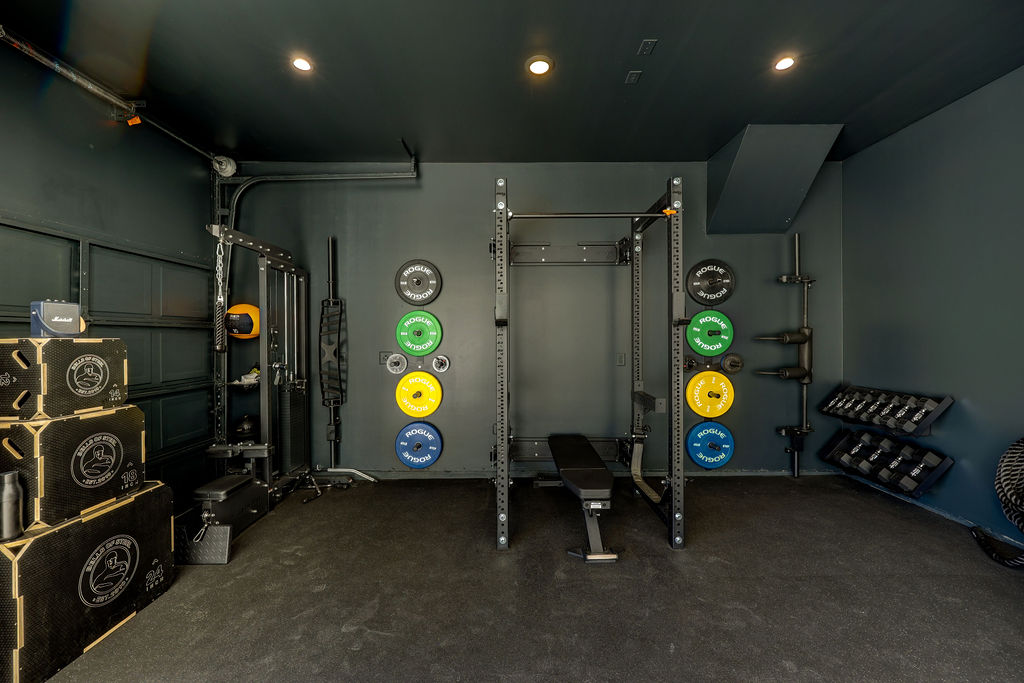 351 Pigeon River Road Kyle, TX 78640 - Photo 22 of 40 Exercise area with a garage and recessed lighting