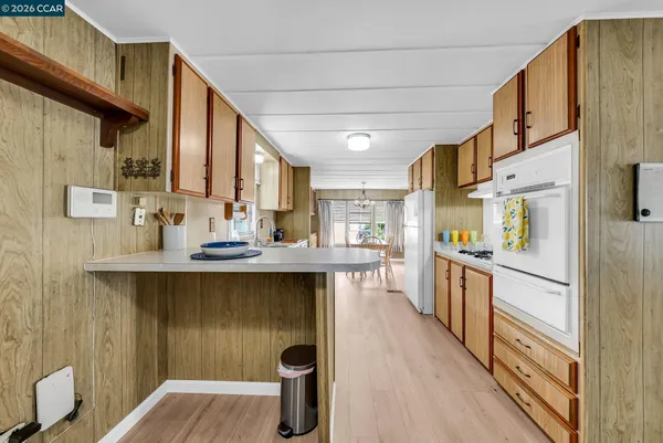 a view of a hallway with wooden shelves
