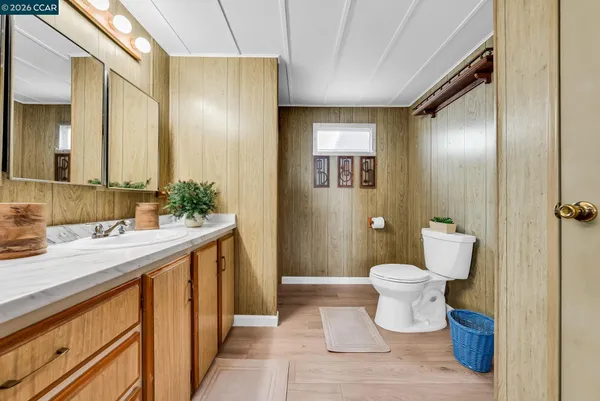 a bathroom with a shower sink and mirror